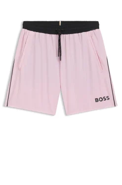 Badeshorts mit kontrastfarbenem Logo und Paspelierung