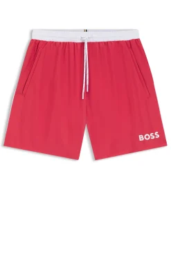 Badeshorts mit kontrastfarbenem Logo und Paspelierung