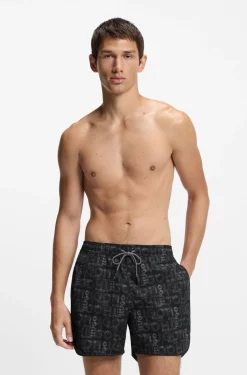 Badeshorts mit saisonalem Print und abgerundetem Saum