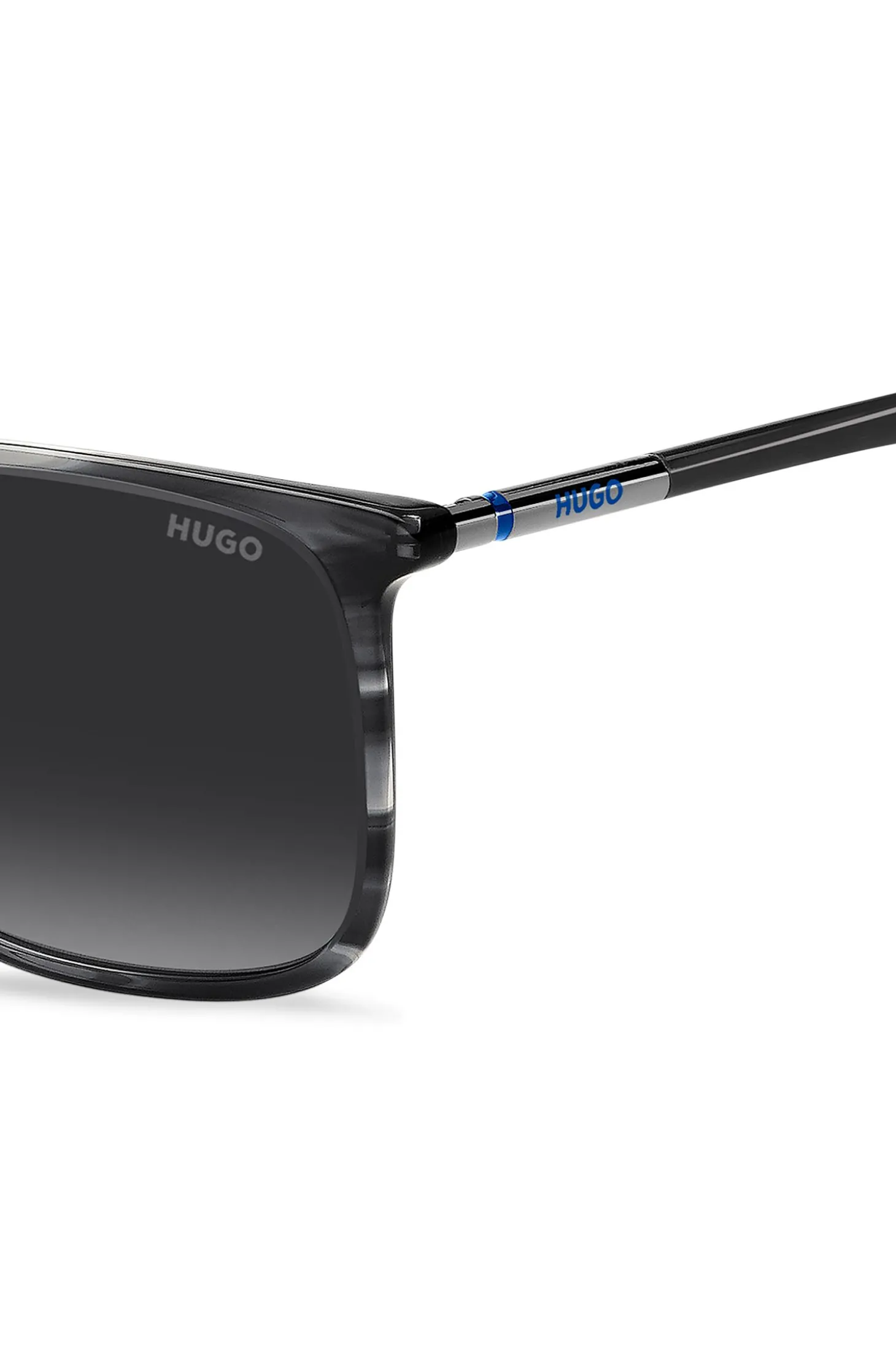 Graue Sonnenbrille aus gemustertem Acetat mit röhrenförmigen Metallbügeln