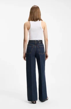 Jeans aus blauem Denim mit weitem Beinverlauf und Bundfalten auf der Vorderseite