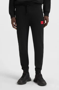 Jogginghose aus Baumwoll-Terry mit rotem Logo-Label