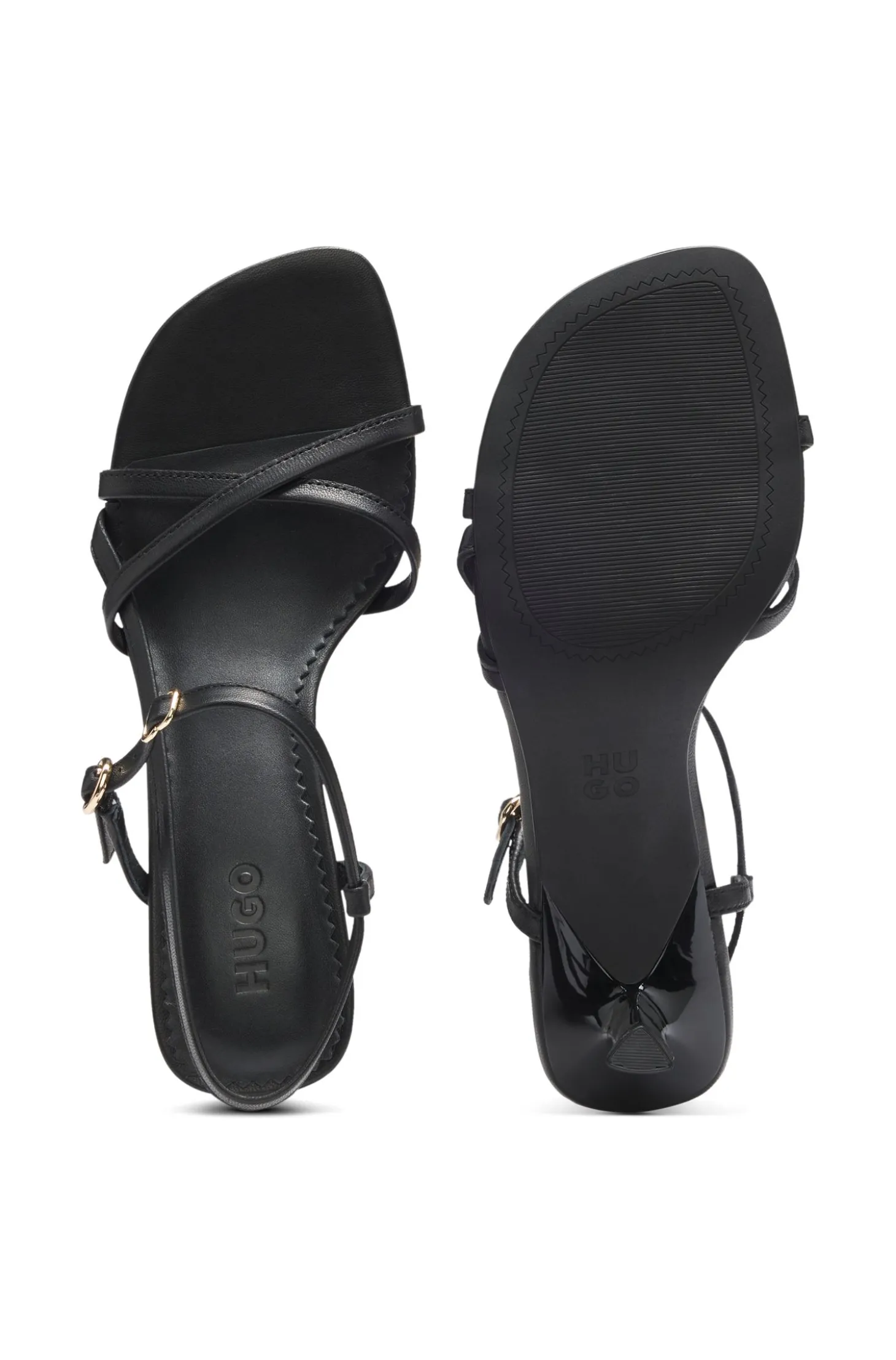 Ledersandalen mit asymmetrischem Absatz und Riemen