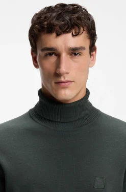 Rollkragenpullover aus Baumwoll-Mix mit Kaschmir und Logo-Aufnäher