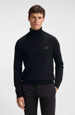 Rollkragenpullover aus Baumwoll-Mix mit Kaschmir und Logo-Aufnäher