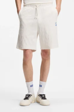 Shorts aus Baumwoll-Frottee mit Leopard-Jacquard
