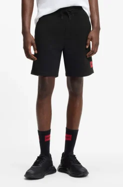 Shorts aus Baumwoll-Terry mit rotem Logo-Label
