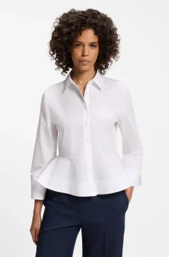 Slim-Fit Bluse aus Baumwolle mit Schößchensaum