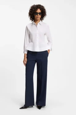 Slim-Fit Bluse aus Baumwolle mit Schößchensaum