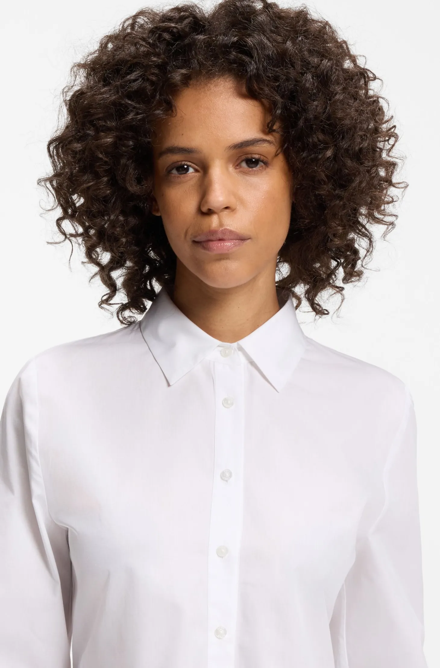 Slim-Fit Bluse aus Baumwolle mit Schößchensaum