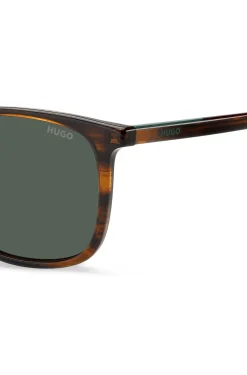 Sonnenbrille in brauner Horn-Optik mit Logo-Details