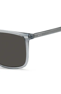 Transparent-blaue Sonnenbrille mit Logo auf den Bügeln