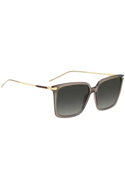 Transparent-braune Sonnenbrille mit goldfarbenen Details