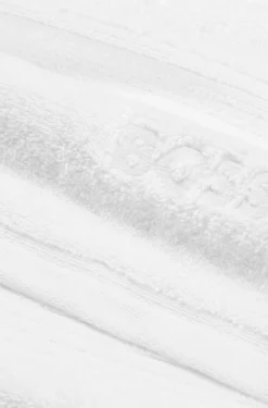 Weiße Badematte aus Baumwolle mit gesticktem Logo